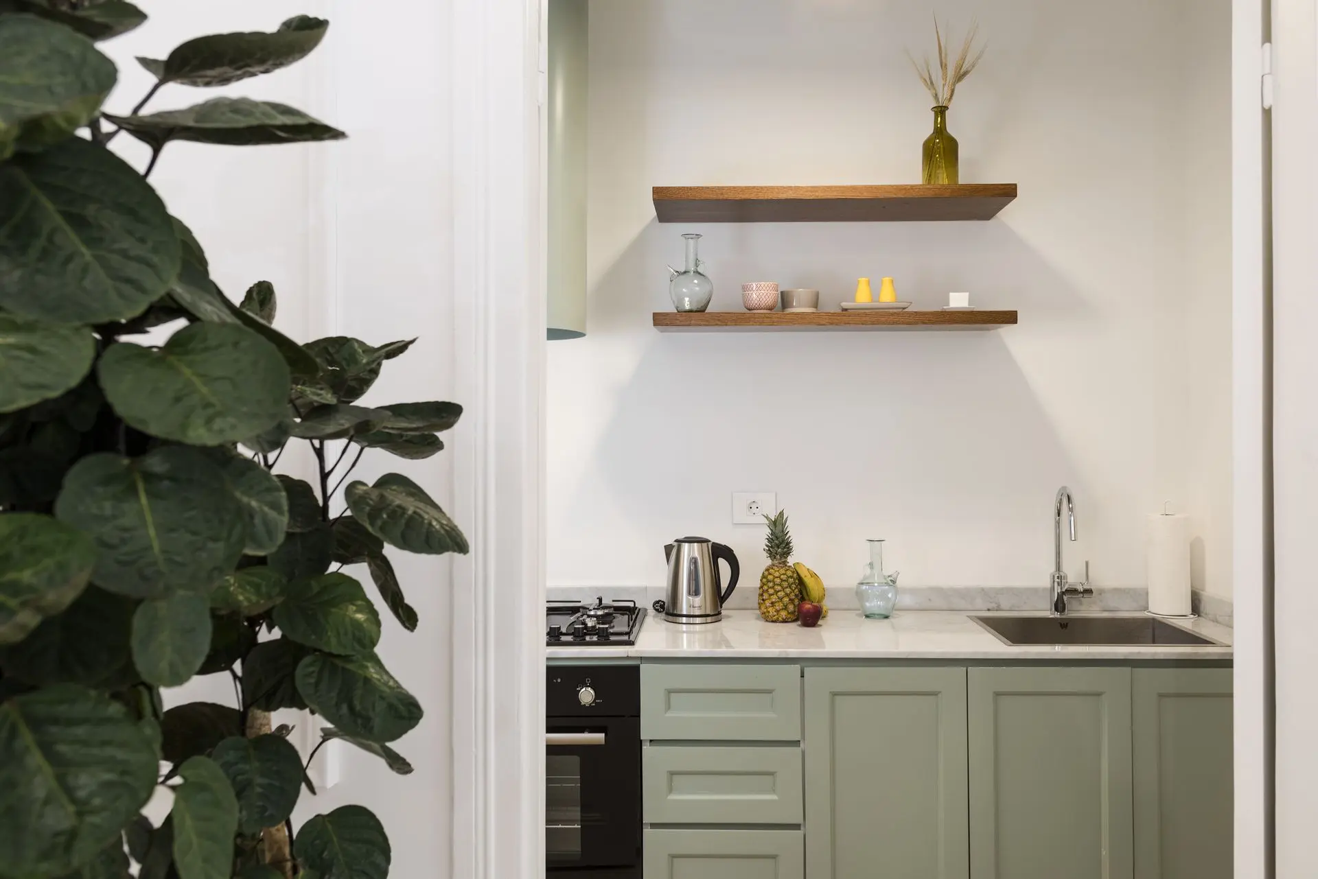 alt=&#34;Modern kitchen nook with open wood shelving and neutral palette&#34;