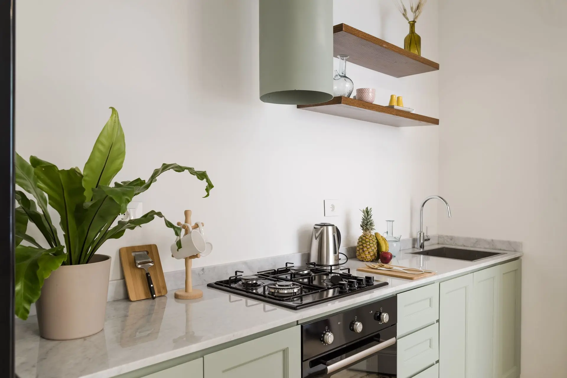 alt=&#34;Modern kitchen nook with open wood shelving and neutral palette&#34;