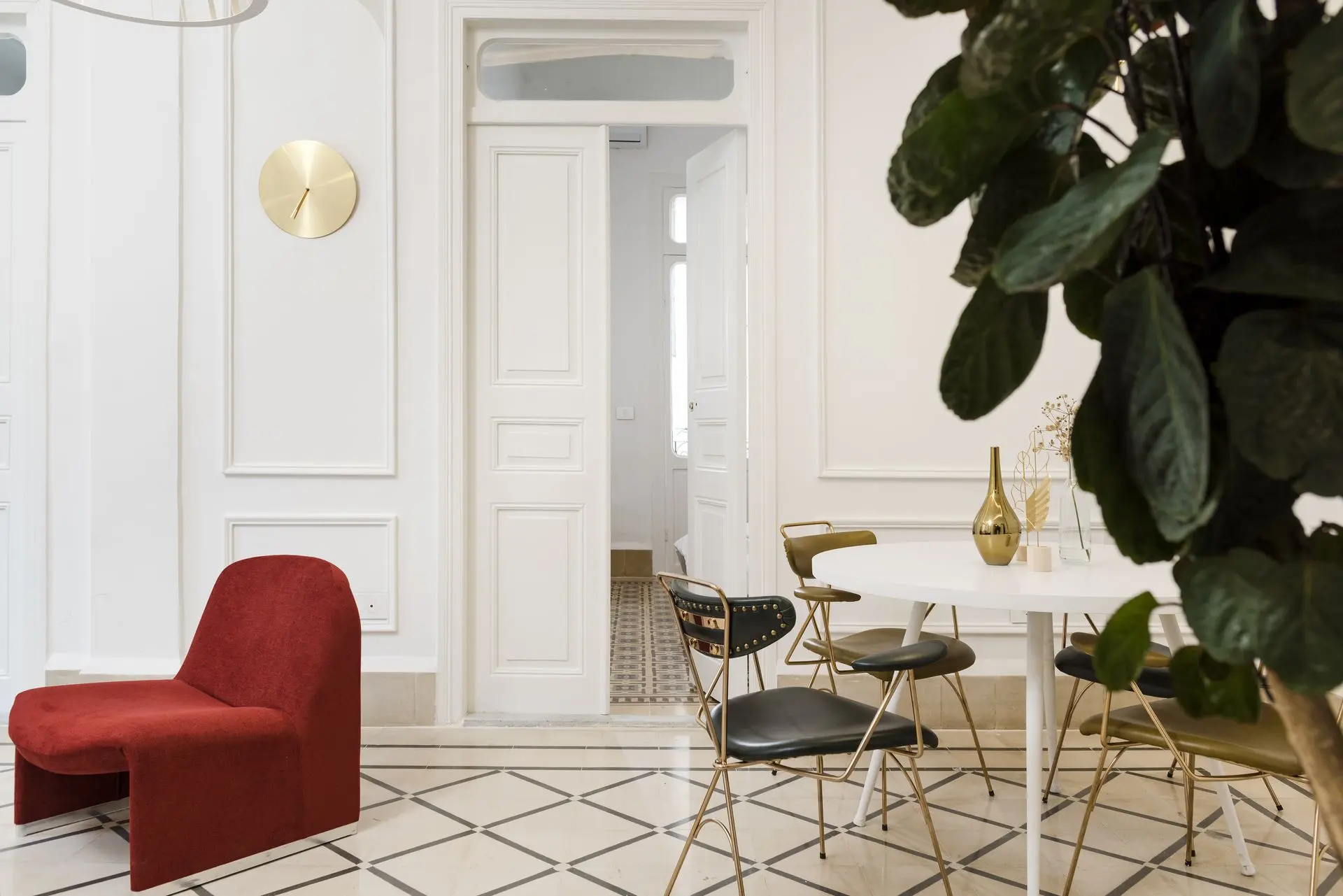 alt=&#34;Living room with terrazzo flooring and potted indoor plants&#34;