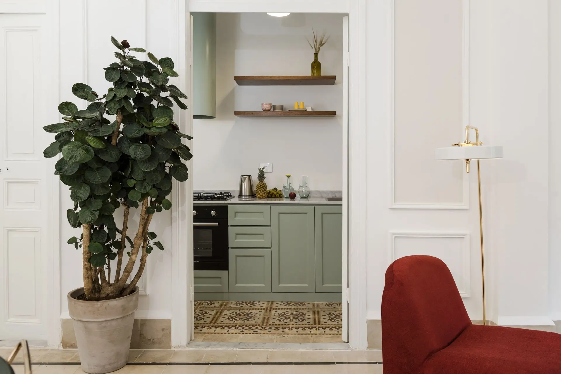 alt=&#34;Modern kitchen nook with open wood shelving and neutral palette&#34;