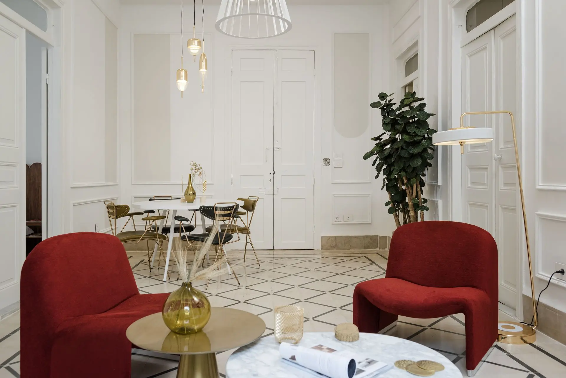 alt=&#34;Elegant dining area with greenery and minimalist white furniture&#34;