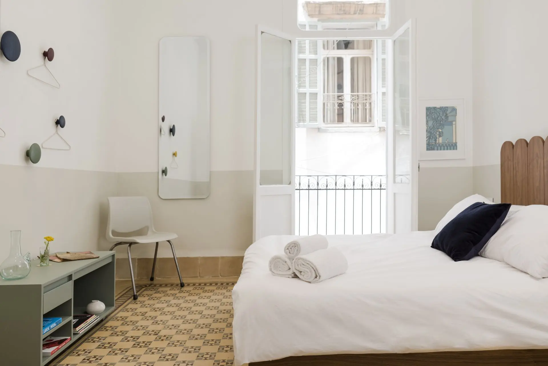 alt=&#34;White bedroom with light wood floor and modern styling&#34;