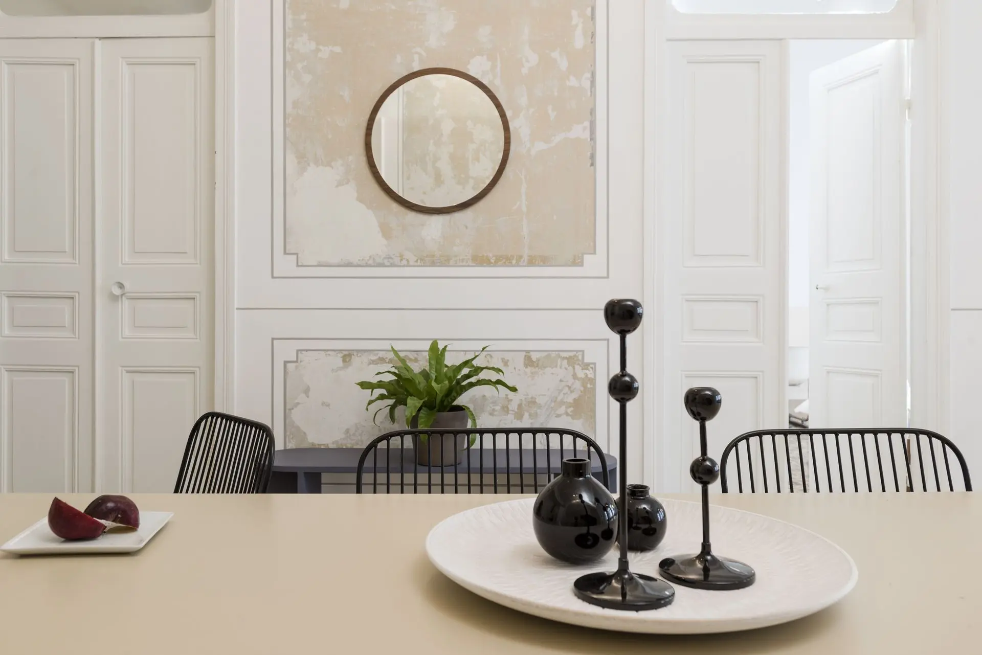 alt=&#34;Modern dining room with vertical wood headboard and white linens&#34;