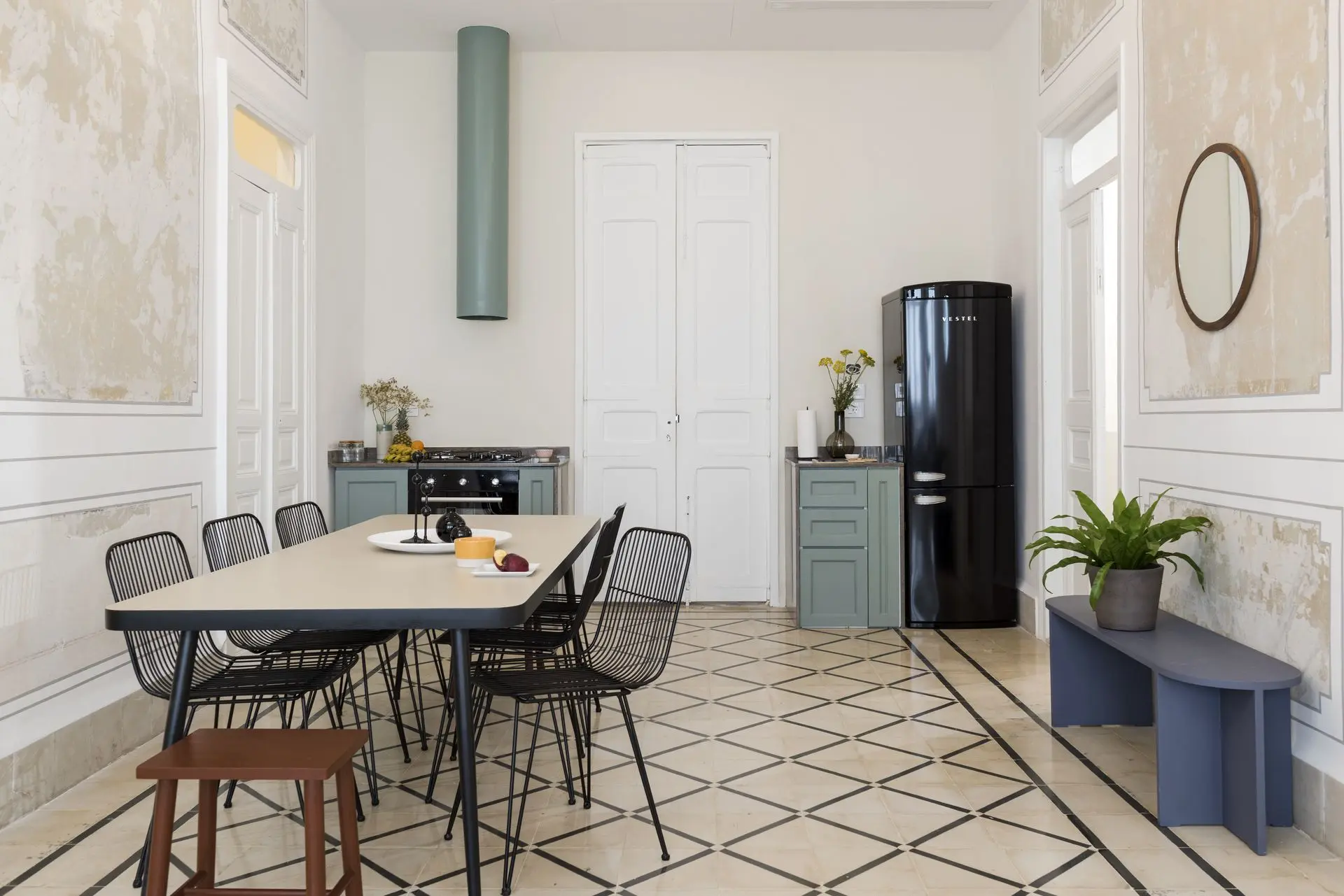 alt=&amp;#34;Modern dining room with vertical wood headboard and white linens&amp;#34;