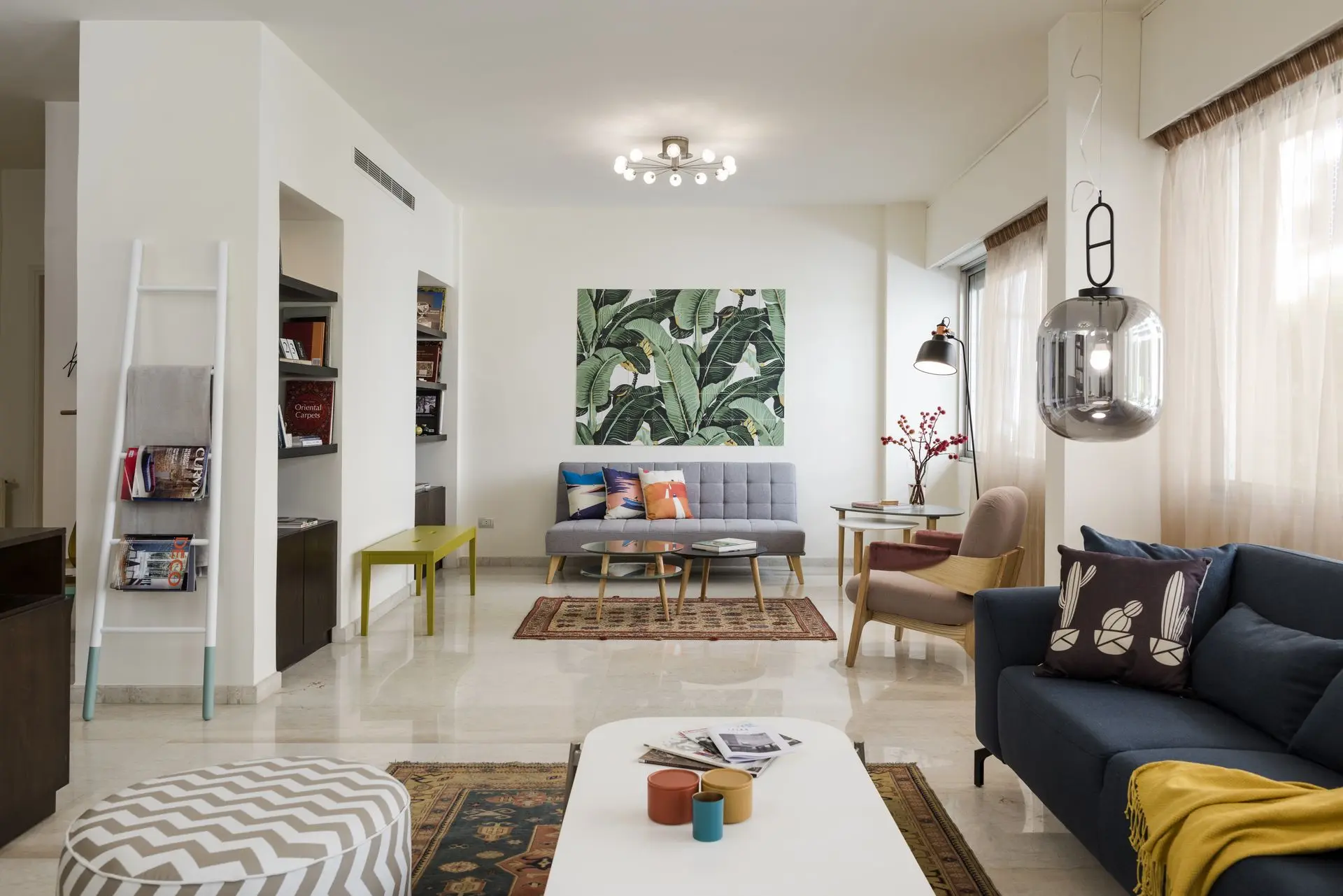 Contemporary interior with green archways and marble flooring