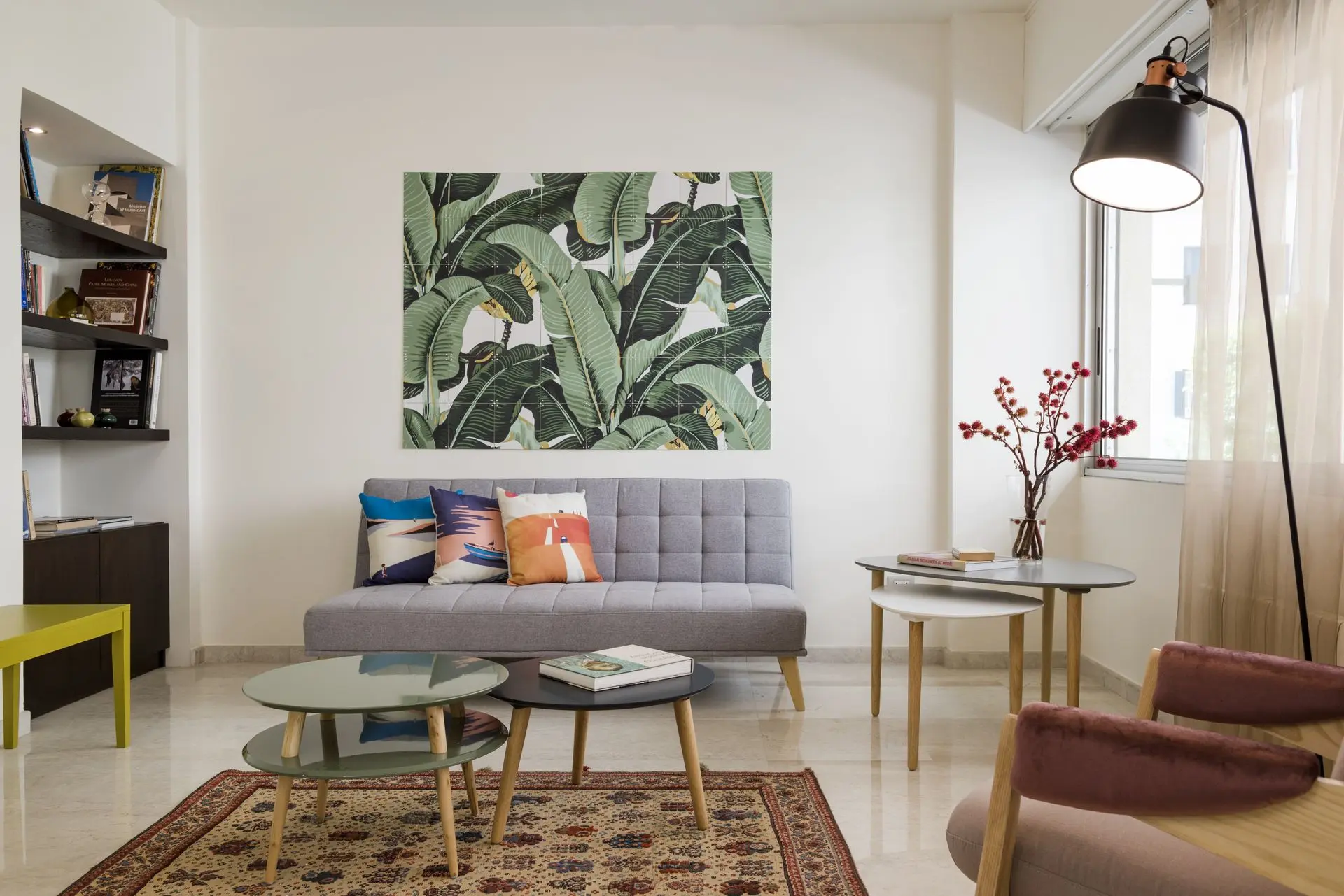 alt=&#34;Creative interior with wall art gallery and mid-century sofa&#34;