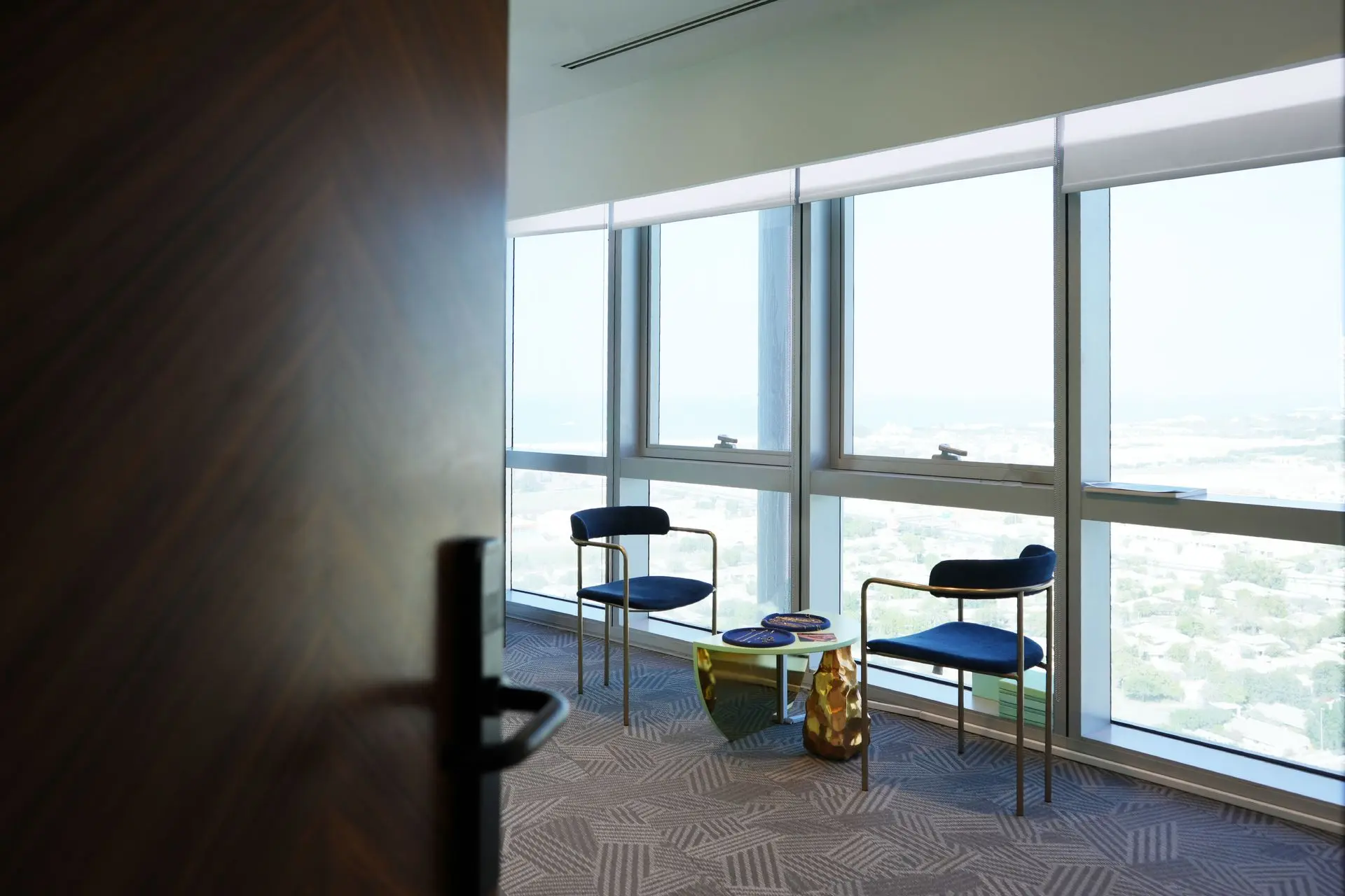 alt=&#34;Elegant Dubai interior with sculpture and floor seating&#34;
