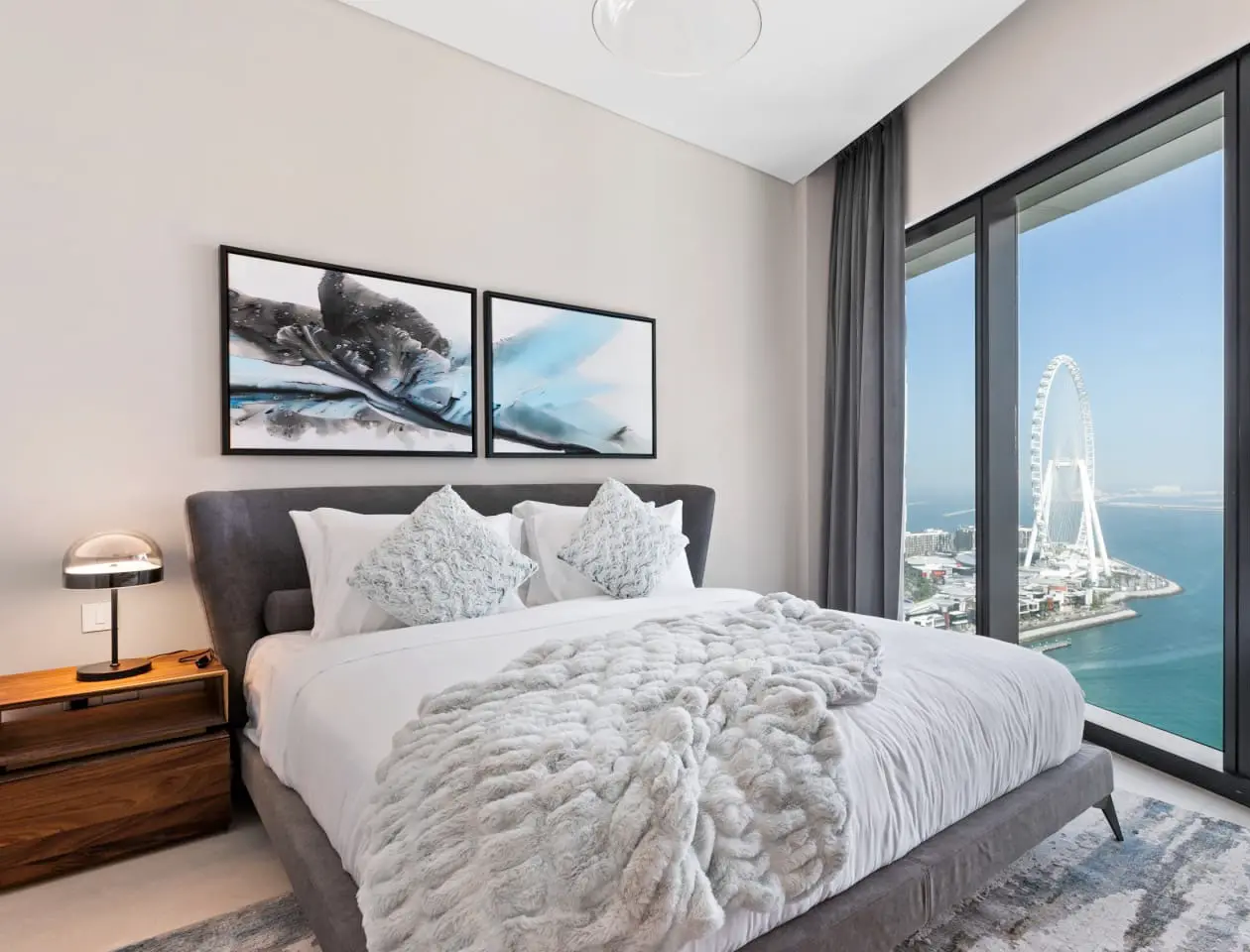 alt=&#34;Hotel-style bedroom suite with natural light and statement bed&#34;