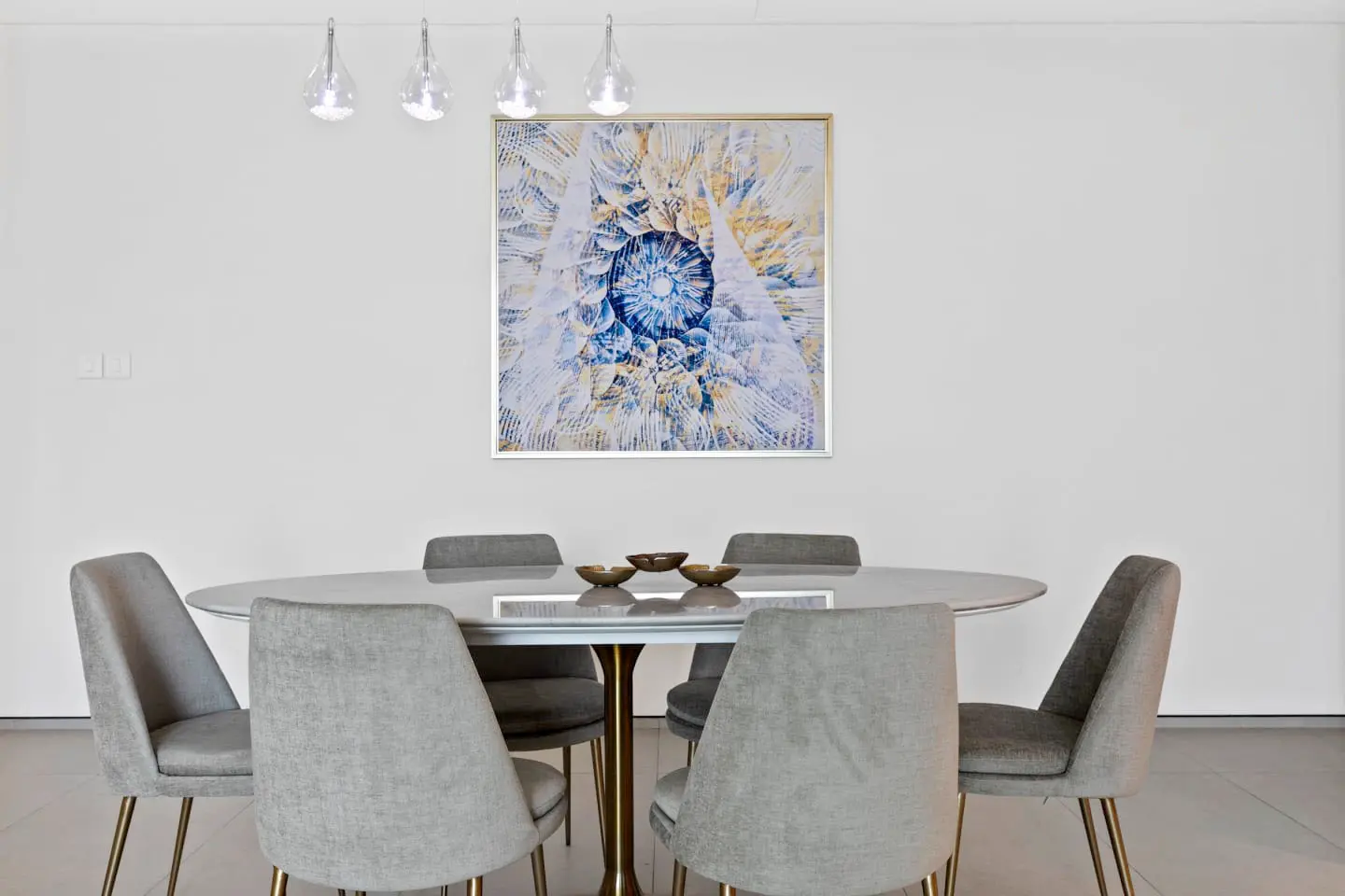alt=&#34;Elegant dining room with contemporary art and marble table&#34;