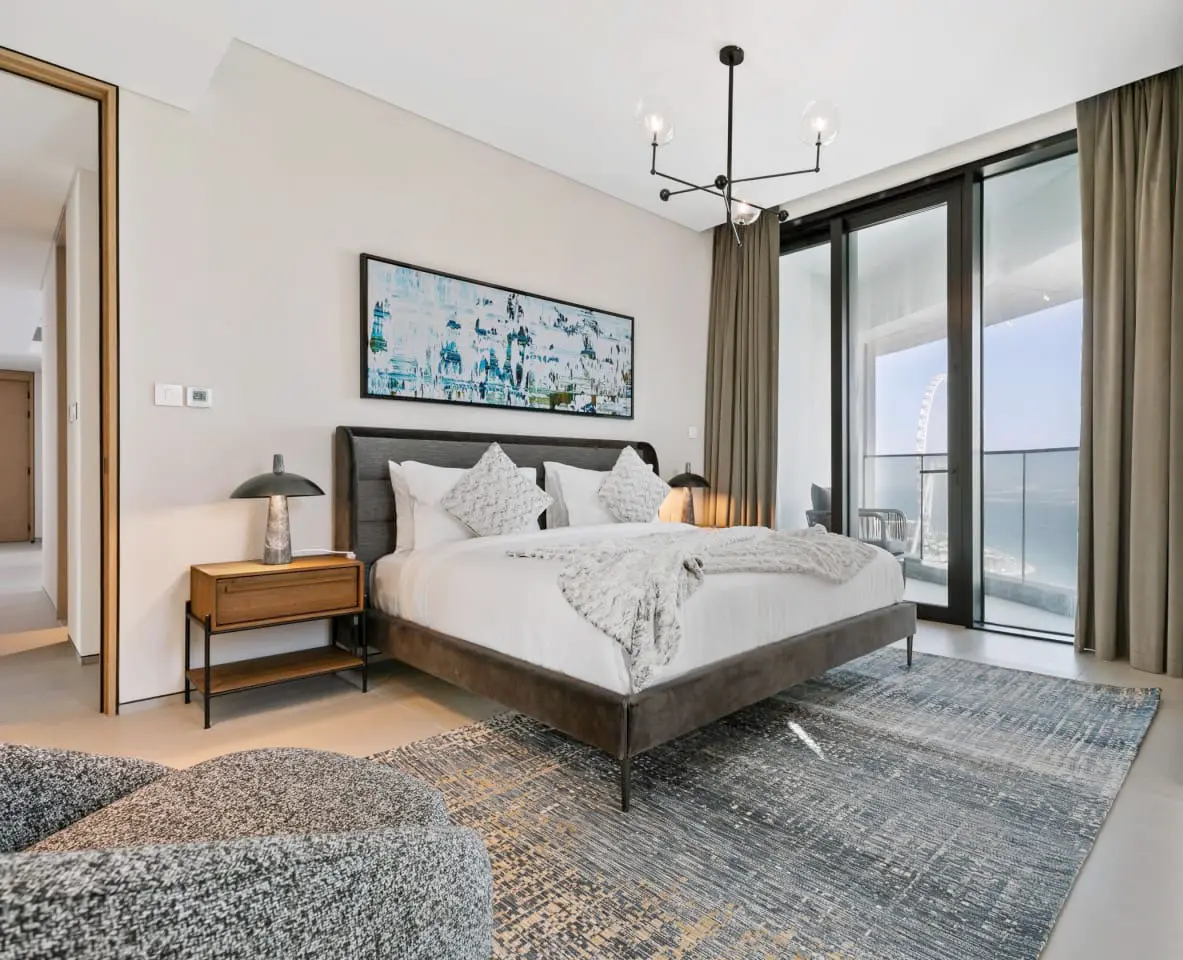 alt=&#34;Hotel-style bedroom suite with natural light and statement bed&#34;