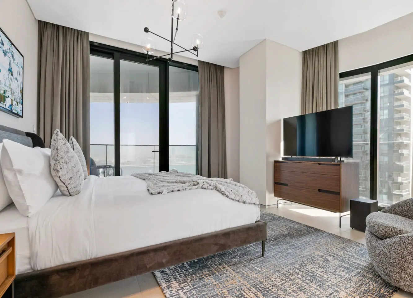 alt=&#34;Hotel-style bedroom suite with natural light and statement bed&#34;