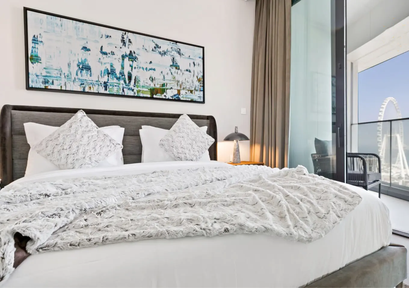 alt=&#34;Hotel-style bedroom suite with natural light and statement bed&#34;